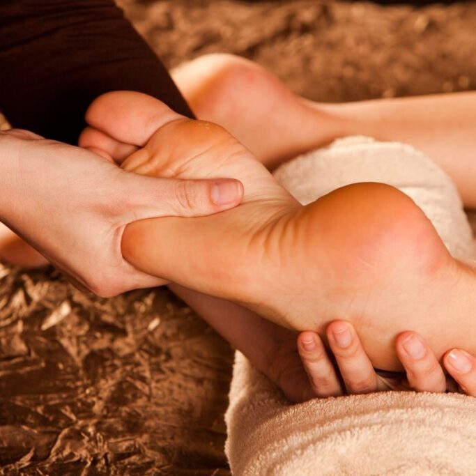 A person is getting their foot massage